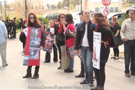 Protestors at Athens Fur Fair say they wear black and red to symbolize the grief they feel for the animals whose blood has been shed. Photo: Katerina Lorenzatos Makris